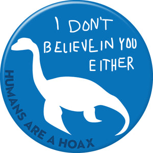 Round button featuring Nessy I don't believe in you either imprint